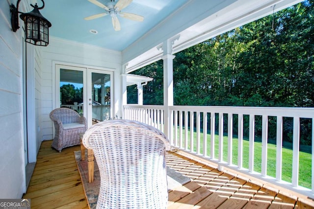 exterior space featuring ceiling fan, a lawn, and french doors