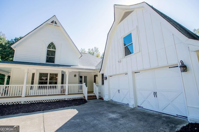 view of front of house featuring covered porch and a garage