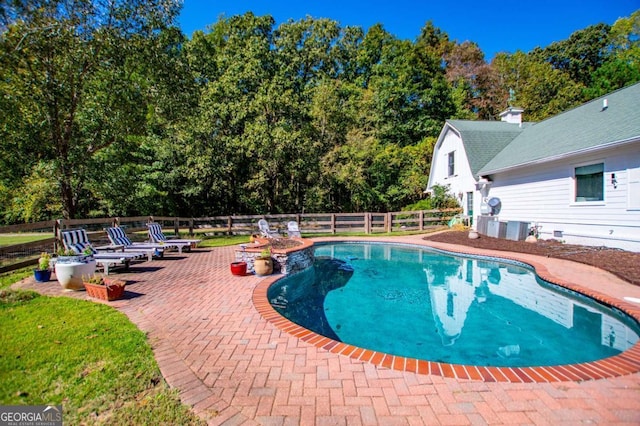 view of swimming pool featuring a patio area