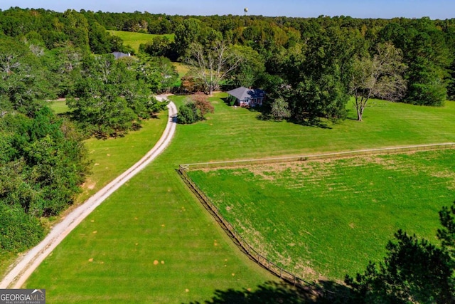 birds eye view of property featuring a rural view