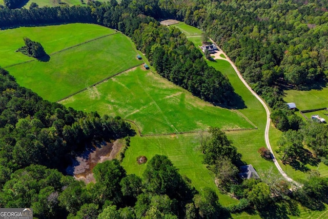 birds eye view of property featuring a rural view