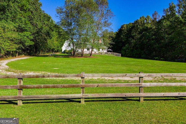 view of yard with a rural view