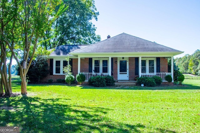 ranch-style house featuring a front yard and a porch