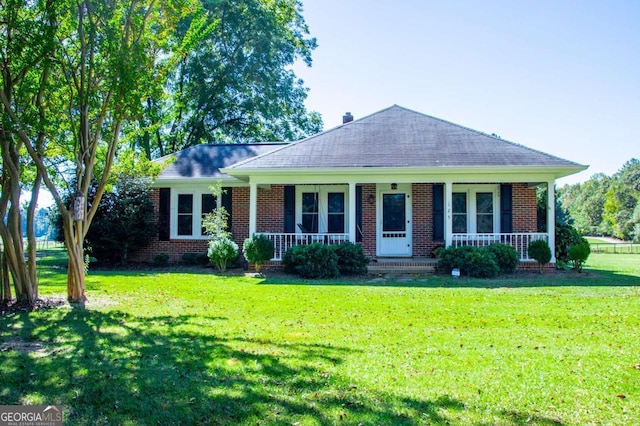 105 Fuller Dr, Carrollton, GA 30117 - view of front of property featuring covered porch, brick siding, roof with shingles, and a front yard