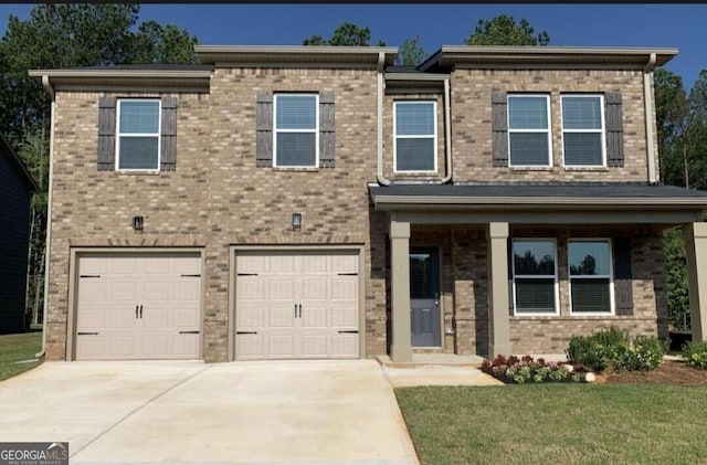 5337 Tolar Rd Unit 61, South Fulton, GA 30213 - view of front of house featuring an attached garage, driveway, brick siding, and a front yard