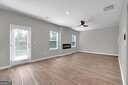 5337 Tolar Rd Unit 61, South Fulton, GA 30213 - unfurnished living room with baseboards and a ceiling fan