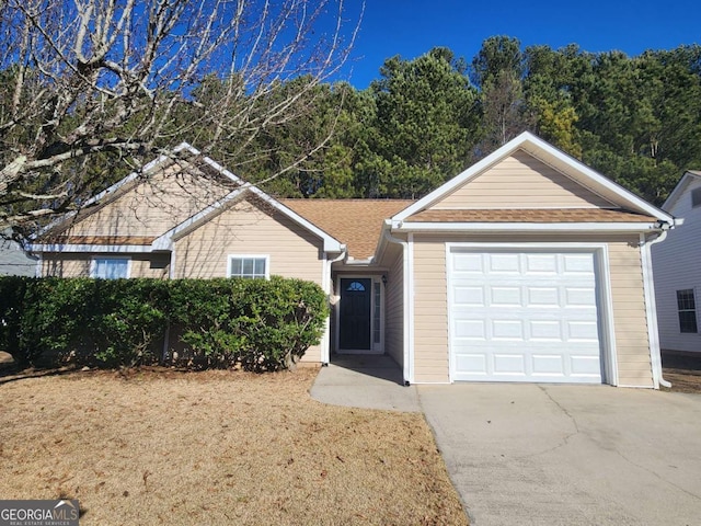 single story home featuring a garage