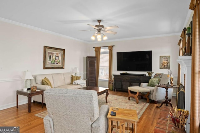 living room featuring ceiling fan, crown molding, and hardwood / wood-style floors