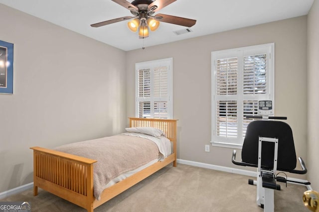 carpeted bedroom with ceiling fan