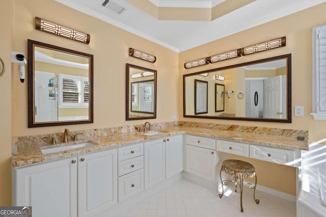 bathroom featuring vanity, crown molding, tile patterned floors, and a tray ceiling