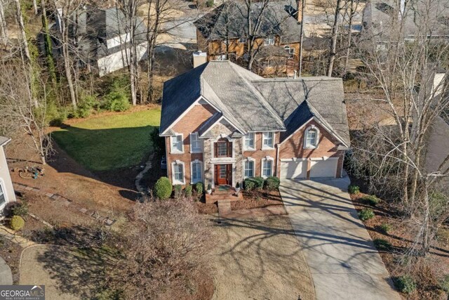 view of front of home with a garage and a front yard