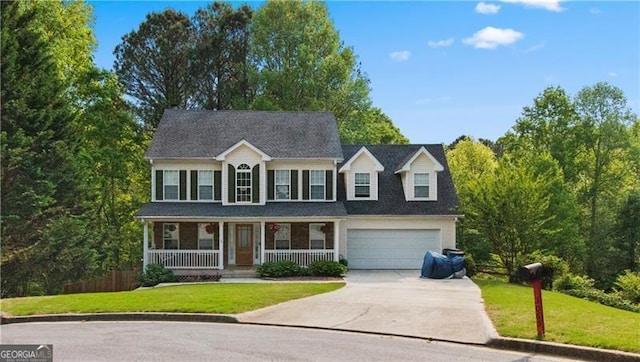 colonial house with a garage, covered porch, and a front lawn