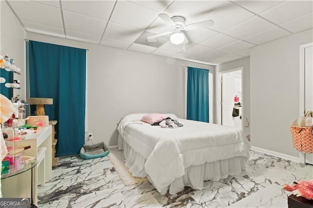 bedroom featuring a paneled ceiling and ceiling fan