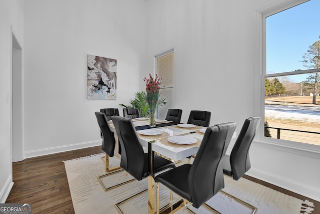 dining space with dark wood-type flooring