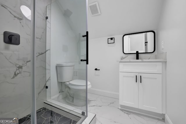 bathroom featuring vanity, toilet, and a shower with door