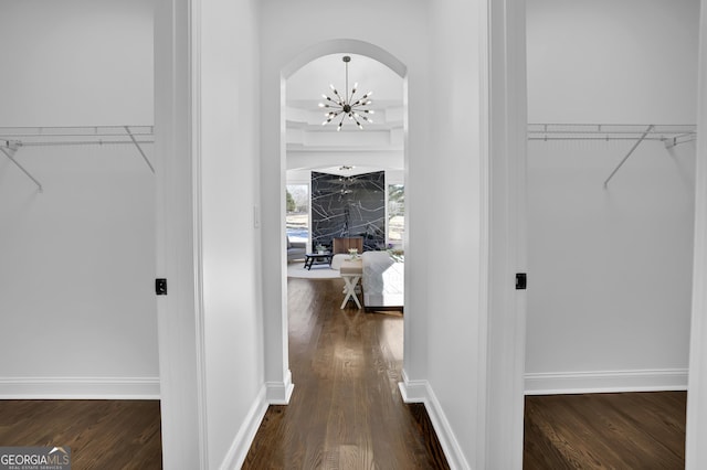 interior space featuring dark hardwood / wood-style floors and a notable chandelier