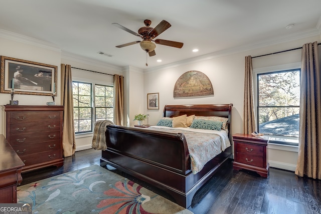 bedroom with ornamental molding, dark wood-type flooring, and ceiling fan