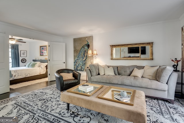 living room featuring ceiling fan and ornamental molding