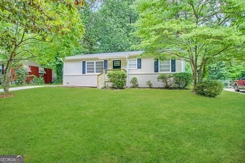 ranch-style home with a front lawn