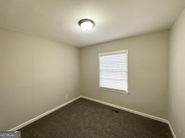 spare room with carpet flooring