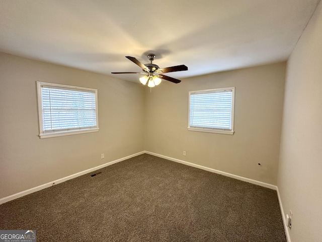 carpeted empty room featuring ceiling fan