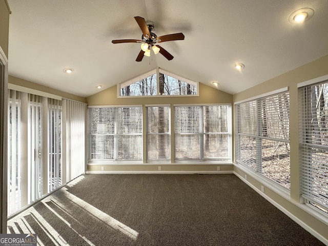 unfurnished sunroom with vaulted ceiling, a healthy amount of sunlight, and ceiling fan