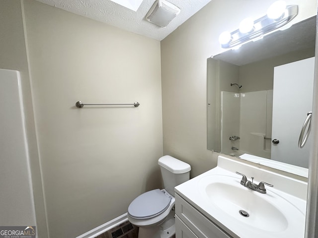 full bathroom with toilet, bathing tub / shower combination, a textured ceiling, and vanity