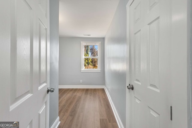 hallway featuring hardwood / wood-style floors