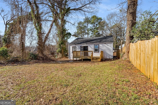 view of yard with a wooden deck