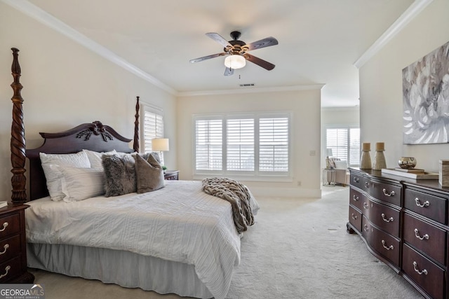 bedroom featuring light carpet, ornamental molding, and ceiling fan