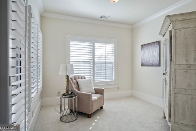 sitting room with light carpet, crown molding, and a healthy amount of sunlight