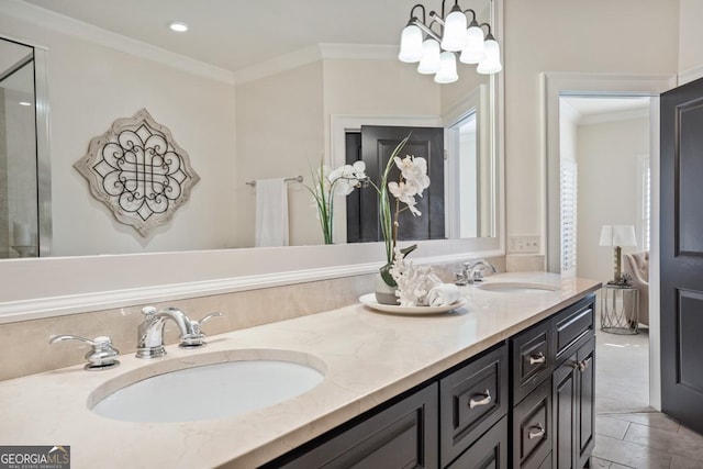 bathroom featuring vanity, tile patterned flooring, crown molding, and a chandelier