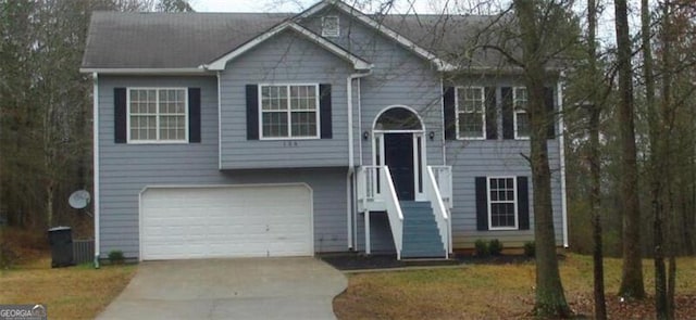 raised ranch featuring a garage