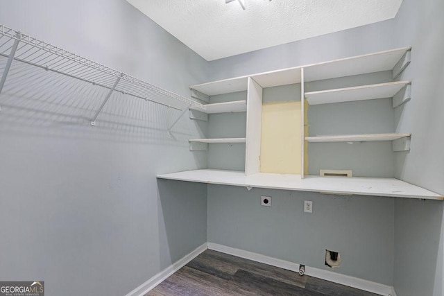 laundry area with hookup for a washing machine, dark wood-type flooring, and hookup for an electric dryer