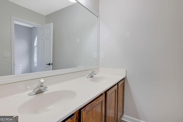 bathroom with vanity and toilet