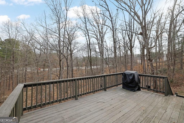 wooden deck featuring grilling area