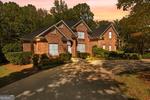 view of front of home featuring brick siding