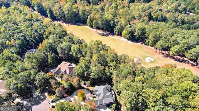 birds eye view of property with a wooded view