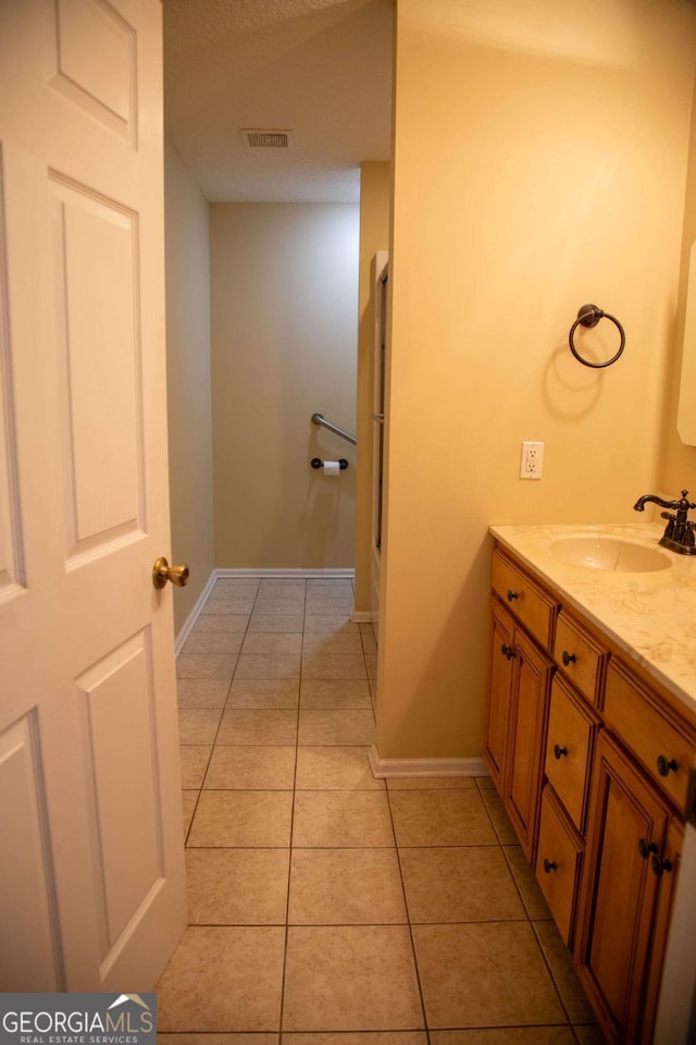 bathroom featuring vanity and tile patterned flooring