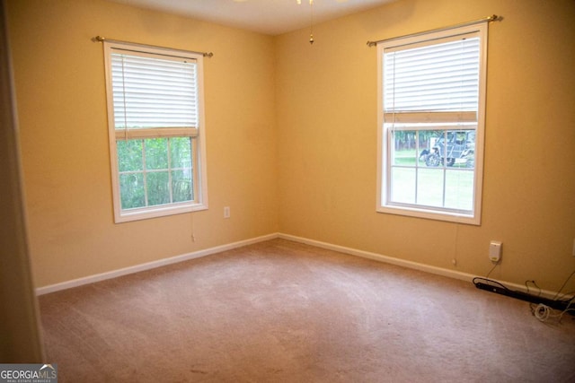 carpeted empty room with ceiling fan