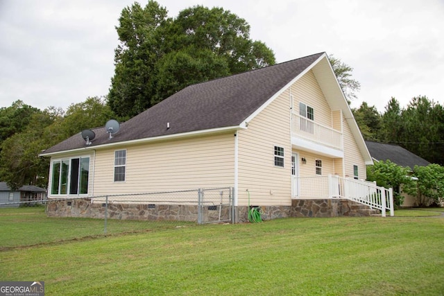 view of side of property with a lawn