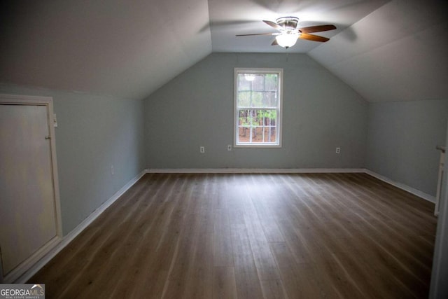 additional living space with ceiling fan, dark hardwood / wood-style flooring, and lofted ceiling