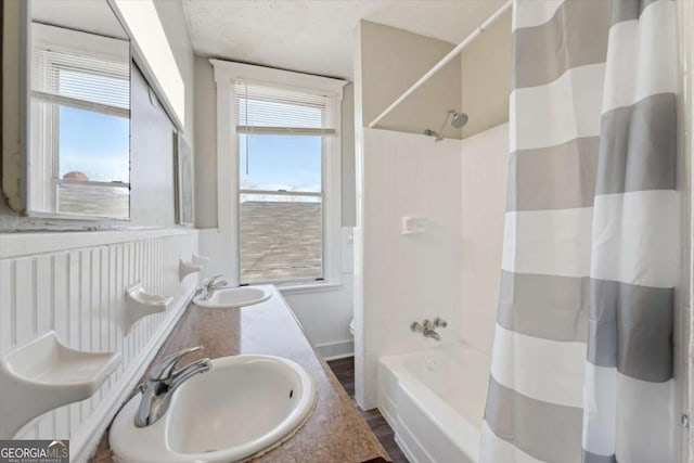 full bathroom featuring toilet, vanity, and shower / bath combination with curtain