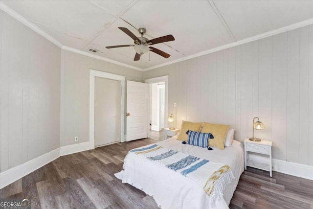 bedroom with ceiling fan, ornamental molding, and dark hardwood / wood-style floors