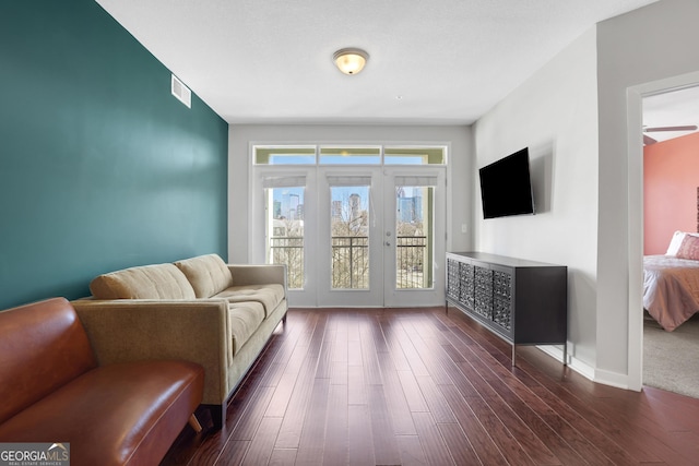 living room with dark hardwood / wood-style flooring