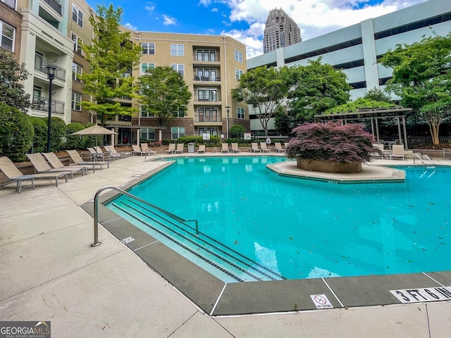 view of swimming pool with a patio area