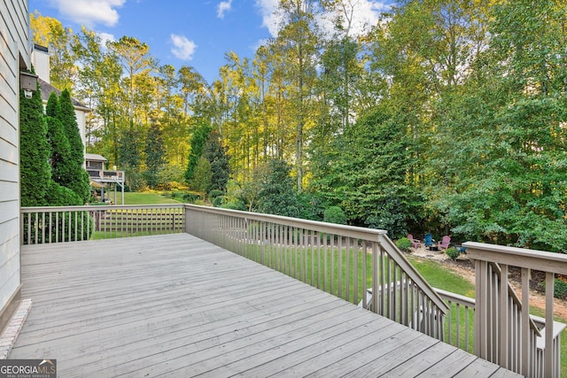 deck featuring a lawn