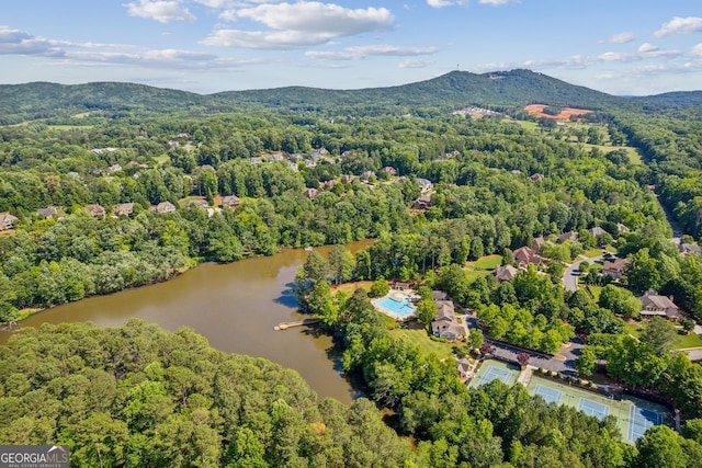 drone / aerial view with a water and mountain view