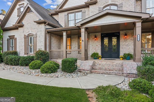 view of exterior entry featuring a porch