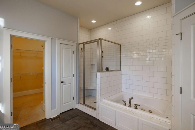 bathroom featuring tile patterned floors and plus walk in shower